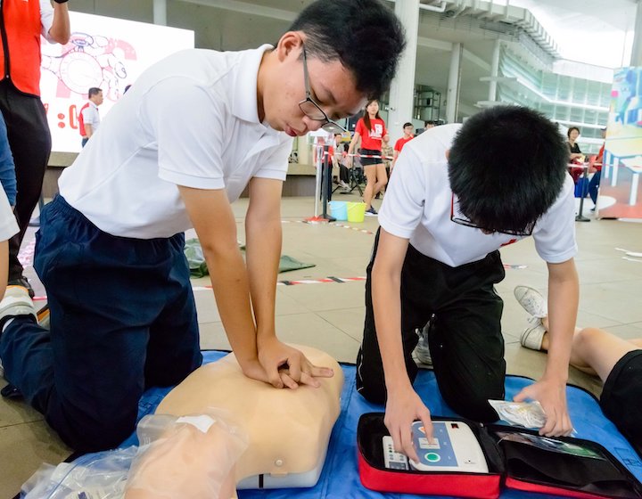 first aid courses singapore singapore red cross teenagers practicing cpr