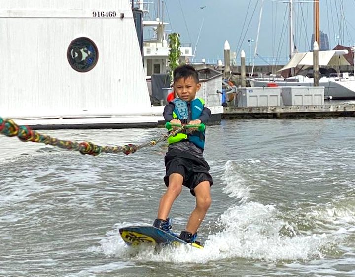 wakeboarding singapore maxout hydrosports little boy riding the waves
