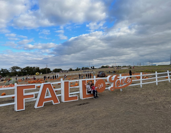 Lina Lie with Son on Pumpkin Patch