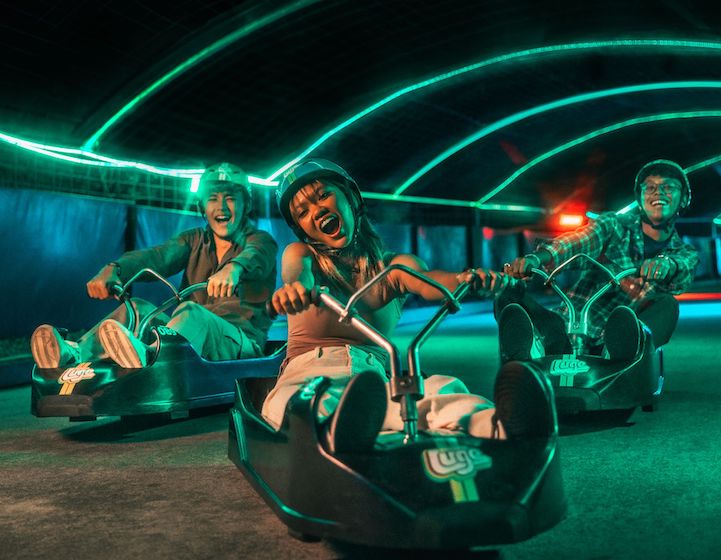 Skyline Night Luge Sentosa with beats and neon-lit tracks