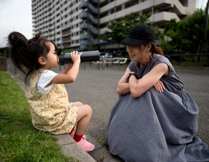 Wfh mum problems singapore - mother watching child drink water outdoors